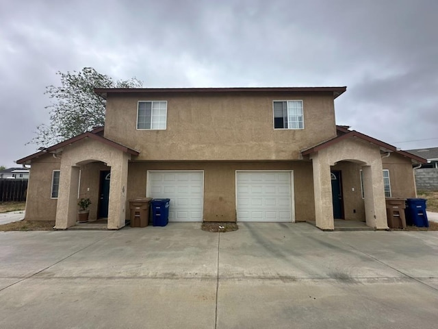 20204 Mini Ct, Tehachapi, CA 93561 - view of front of home featuring an attached garage, stucco siding, and driveway