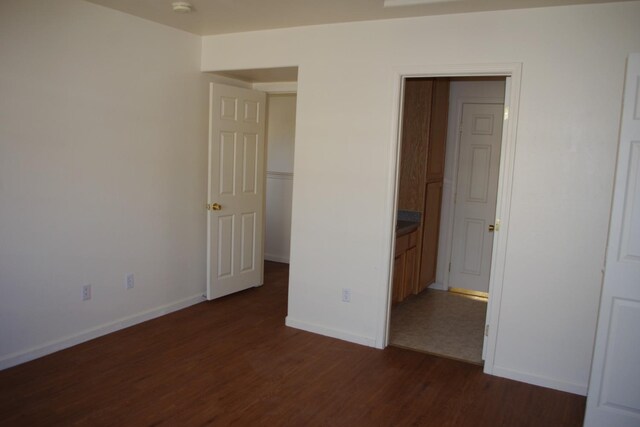 20204 Mini Ct, Tehachapi, CA 93561 - unfurnished bedroom with dark wood-type flooring and baseboards