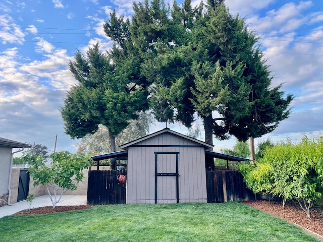 view of shed with fence