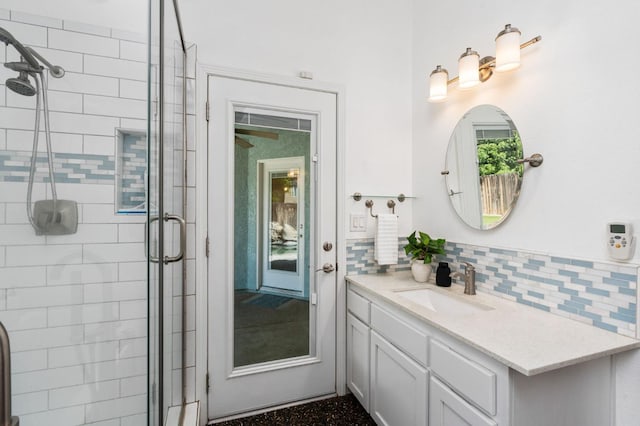 4650 W Chennault Ave, Fresno, CA 93722 - full bathroom with a shower stall, vanity, and tasteful backsplash