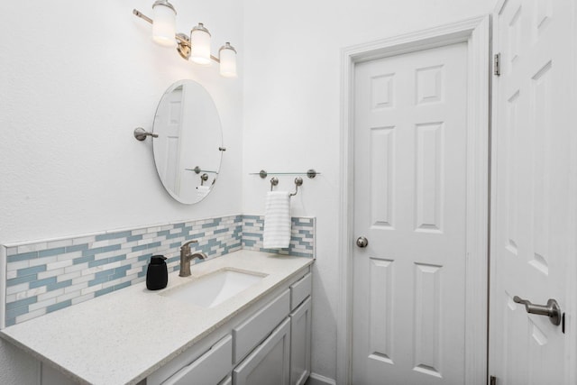 4650 W Chennault Ave, Fresno, CA 93722 - bathroom featuring tasteful backsplash and vanity