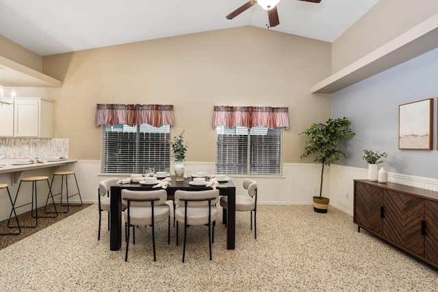 4650 W Chennault Ave, Fresno, CA 93722 - dining area featuring wainscoting, ceiling fan, and lofted ceiling