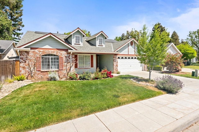 4650 W Chennault Ave, Fresno, CA 93722 - view of front facade with brick siding, concrete driveway, an attached garage, and roof with shingles