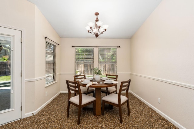 4650 W Chennault Ave, Fresno, CA 93722 - dining area featuring baseboards and a chandelier