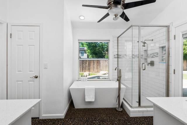 4650 W Chennault Ave, Fresno, CA 93722 - bathroom with vanity, a stall shower, a freestanding bath, and baseboards