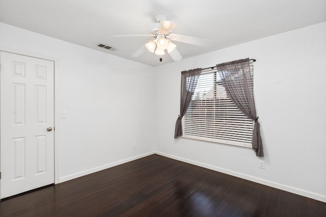 4650 W Chennault Ave, Fresno, CA 93722 - empty room featuring baseboards, dark wood-type flooring, and a ceiling fan