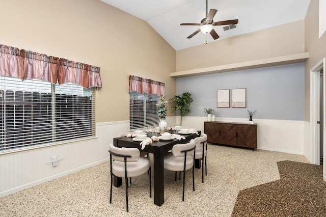 4650 W Chennault Ave, Fresno, CA 93722 - dining space featuring a wainscoted wall, ceiling fan, and high vaulted ceiling