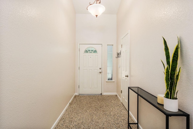 4650 W Chennault Ave, Fresno, CA 93722 - entryway featuring baseboards and carpet floors