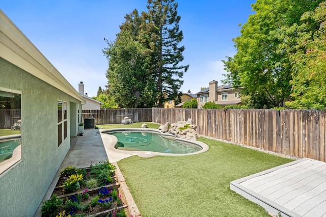 4650 W Chennault Ave, Fresno, CA 93722 - view of yard with a patio area and central AC