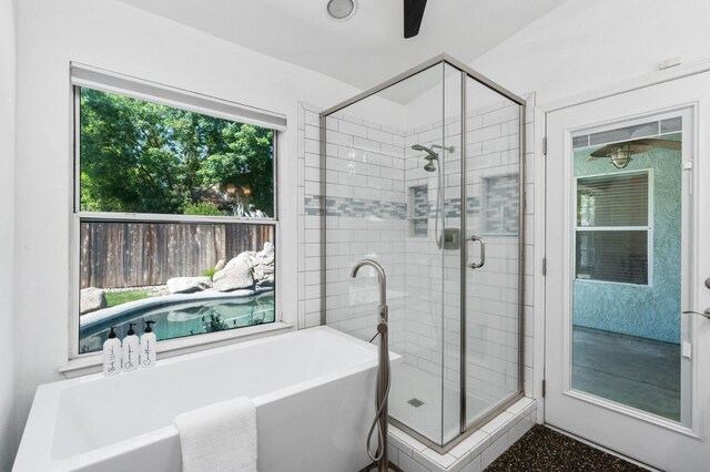 4650 W Chennault Ave, Fresno, CA 93722 - bathroom featuring a stall shower and a freestanding tub