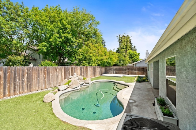 4650 W Chennault Ave, Fresno, CA 93722 - view of swimming pool with central AC unit and a patio