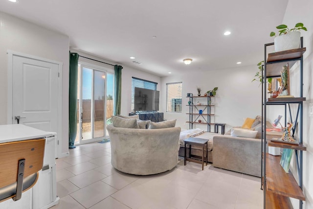 living room featuring light tile patterned floors, recessed lighting, and visible vents