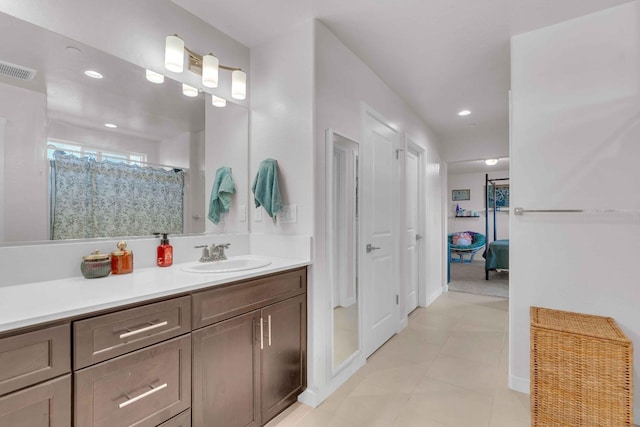 bathroom featuring vanity, a shower with shower curtain, recessed lighting, baseboards, and visible vents