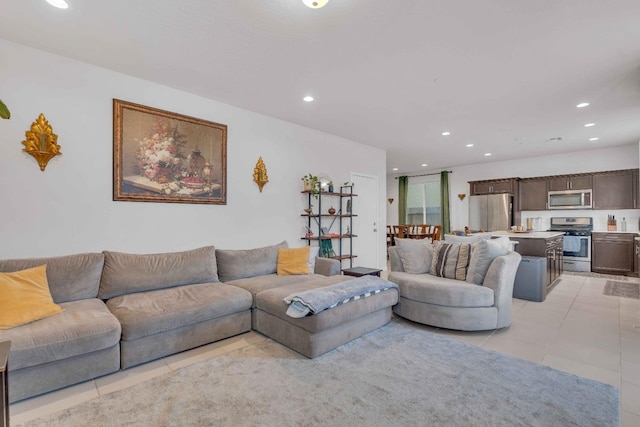 living area with light tile patterned floors and recessed lighting