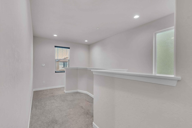 interior space with carpet floors, recessed lighting, and baseboards