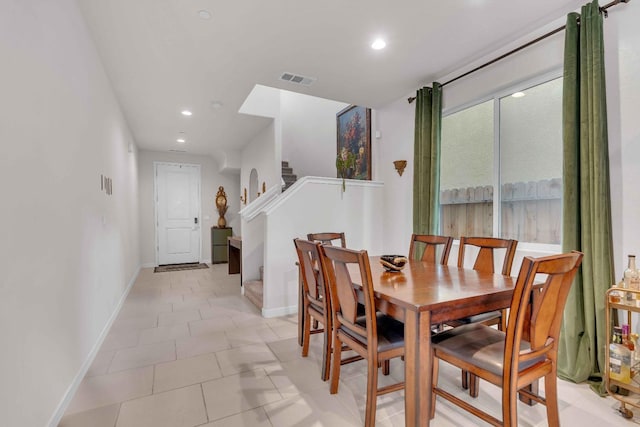 dining room featuring baseboards, recessed lighting, and visible vents