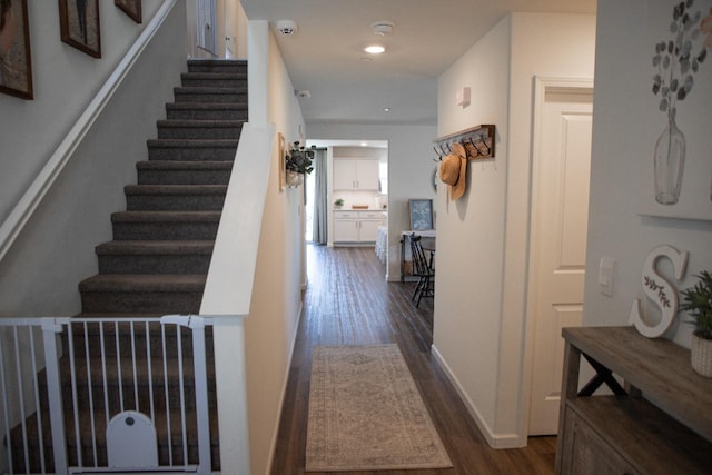 interior space featuring stairway, baseboards, recessed lighting, and dark wood finished floors