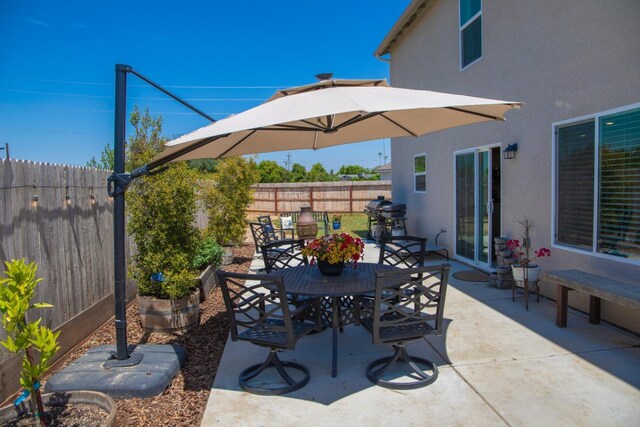 1845 George Ave, Sanger, CA 93657 - view of patio / terrace featuring outdoor dining space, a fenced backyard, and area for grilling