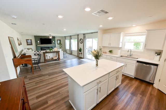 1845 George Ave, Sanger, CA 93657 - kitchen featuring stainless steel dishwasher, a sink, dark wood-style flooring, healthy amount of natural light, and recessed lighting