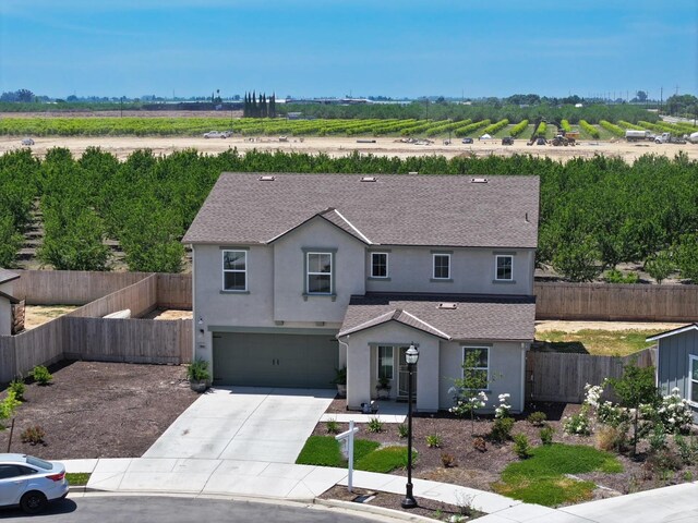 1845 George Ave, Sanger, CA 93657 - traditional-style house featuring stucco siding, roof with shingles, concrete driveway, and a garage
