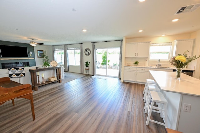 1845 George Ave, Sanger, CA 93657 - kitchen featuring open floor plan, a sink, white cabinets, healthy amount of natural light, and recessed lighting