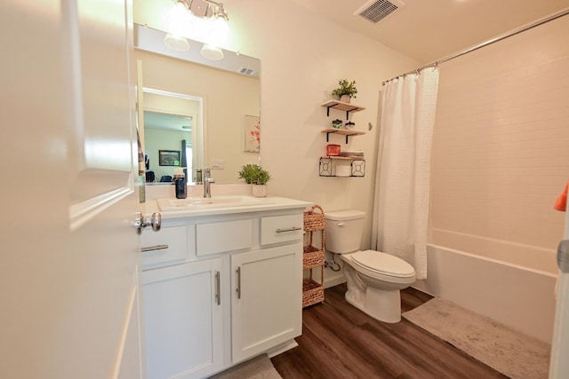 1845 George Ave, Sanger, CA 93657 - bathroom with toilet, wood finished floors, vanity, and shower / bath combo with shower curtain