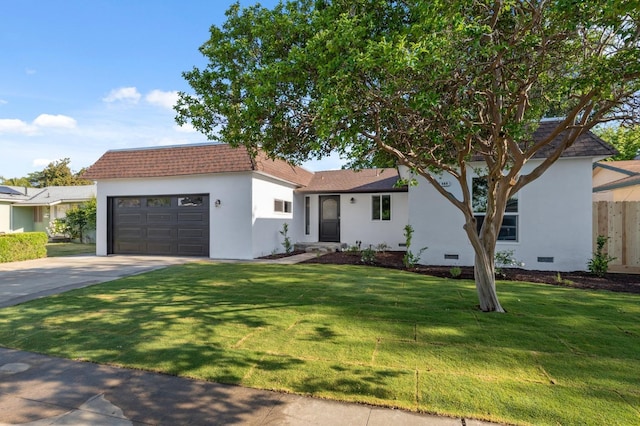 ranch-style home featuring stucco siding, driveway, a front lawn, and a garage