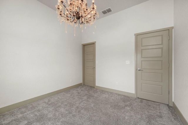855 Groveland Ave W, Madera, CA 93636 - spare room with carpet, a chandelier, and visible vents
