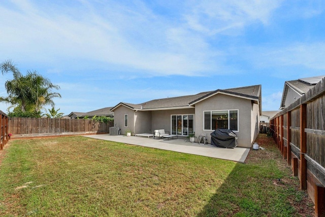 855 Groveland Ave W, Madera, CA 93636 - rear view of house featuring a yard, a patio area, and stucco siding
