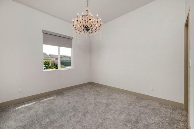 855 Groveland Ave W, Madera, CA 93636 - carpeted empty room featuring an inviting chandelier and baseboards