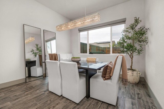 855 Groveland Ave W, Madera, CA 93636 - dining area with an inviting chandelier and wood finished floors