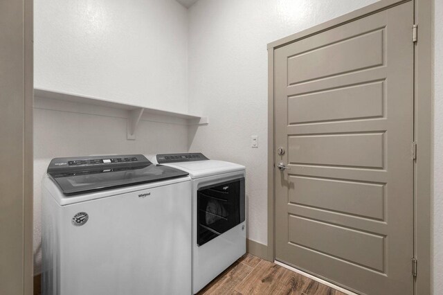 855 Groveland Ave W, Madera, CA 93636 - laundry room featuring baseboards, laundry area, washing machine and dryer, and wood finished floors