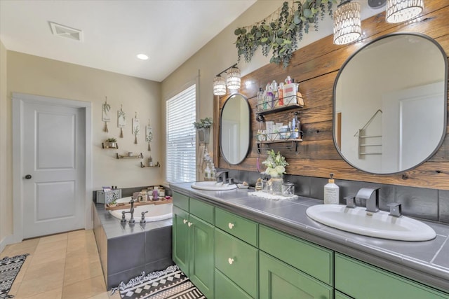 full bathroom featuring a garden tub, a sink, double vanity, and visible vents