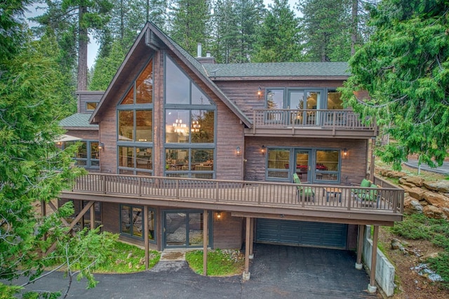 40596 Wild Iris Ln, Shaver Lake, CA 93664 - rear view of property with an attached garage, driveway, and a balcony