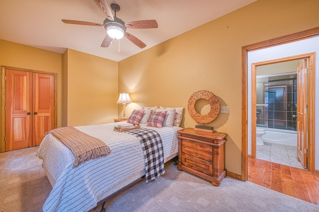 40596 Wild Iris Ln, Shaver Lake, CA 93664 - carpeted bedroom featuring a closet, a ceiling fan, baseboards, and ensuite bathroom