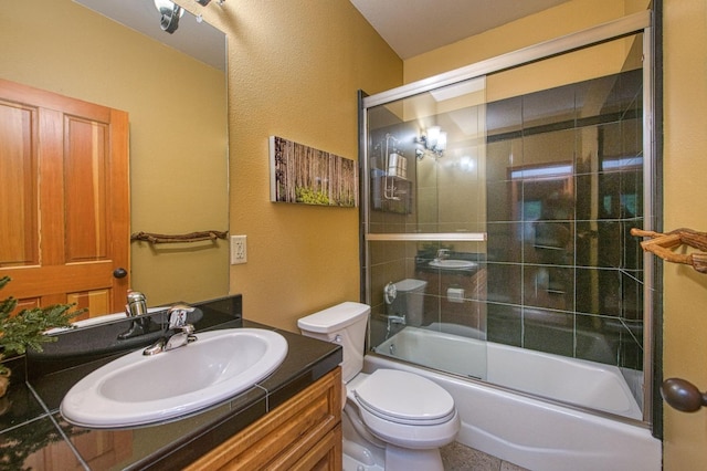 40596 Wild Iris Ln, Shaver Lake, CA 93664 - full bath with toilet, a textured wall, enclosed tub / shower combo, and vanity