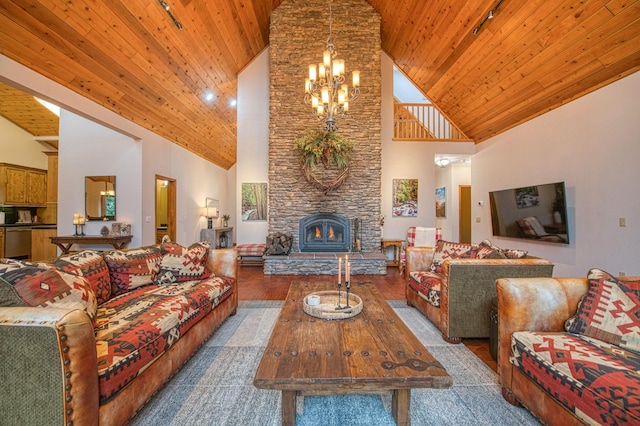 40596 Wild Iris Ln, Shaver Lake, CA 93664 - living area with wood ceiling, a fireplace, wood finished floors, high vaulted ceiling, and an inviting chandelier