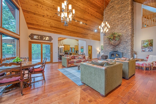 40596 Wild Iris Ln, Shaver Lake, CA 93664 - living room featuring light wood-style floors, high vaulted ceiling, and a notable chandelier