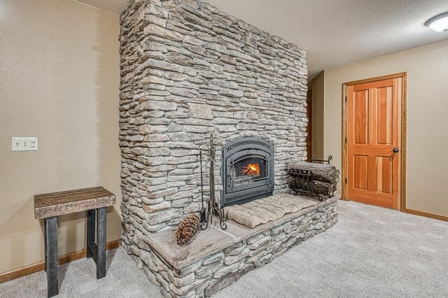40596 Wild Iris Ln, Shaver Lake, CA 93664 - carpeted living area with baseboards, a textured ceiling, and a fireplace