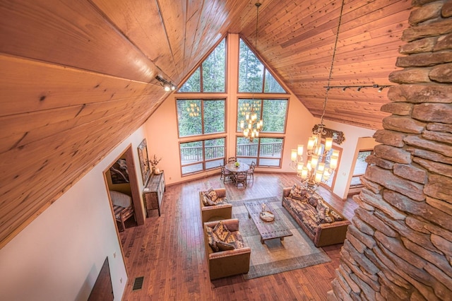 40596 Wild Iris Ln, Shaver Lake, CA 93664 - living room with wood ceiling, a wealth of natural light, visible vents, and a chandelier