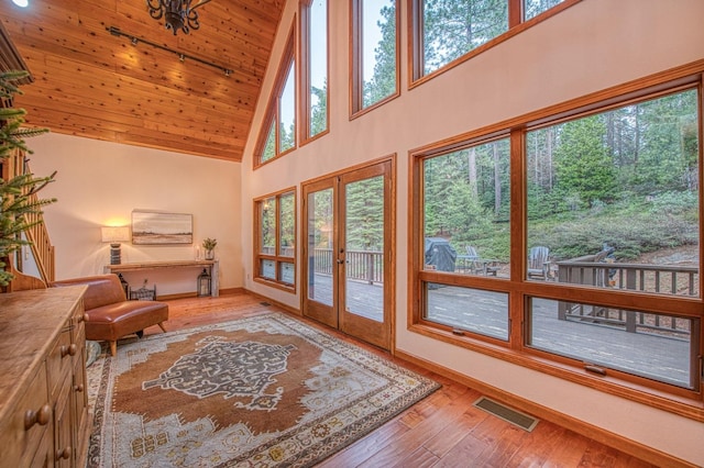 40596 Wild Iris Ln, Shaver Lake, CA 93664 - doorway to outside featuring high vaulted ceiling, french doors, hardwood / wood-style floors, wooden ceiling, and visible vents