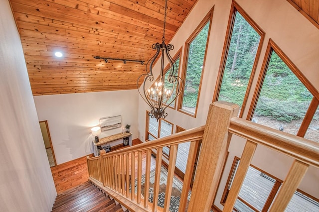 40596 Wild Iris Ln, Shaver Lake, CA 93664 - stairs featuring a chandelier, wood ceiling, lofted ceiling, and wood finished floors