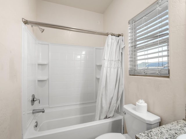 full bath with shower / bath combo with shower curtain, toilet, and vanity