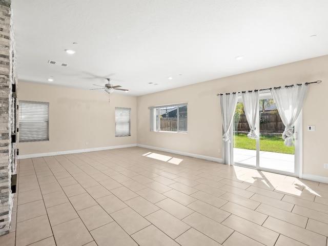unfurnished room with a ceiling fan, visible vents, light tile patterned floors, baseboards, and recessed lighting