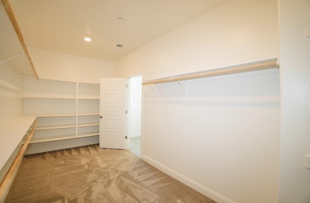 spacious closet featuring carpet floors and visible vents