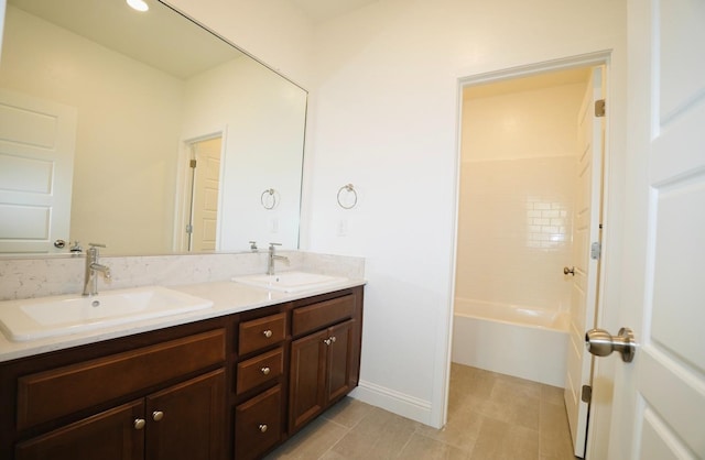 bathroom featuring a sink, tile patterned floors, and double vanity