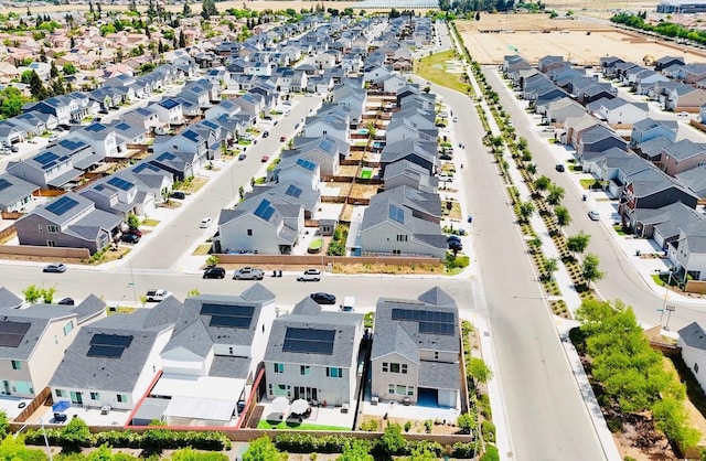 birds eye view of property with a residential view
