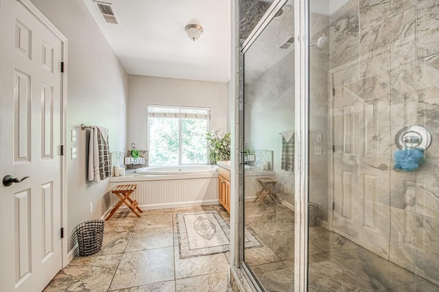 bathroom featuring vanity, a bath, visible vents, and a shower stall