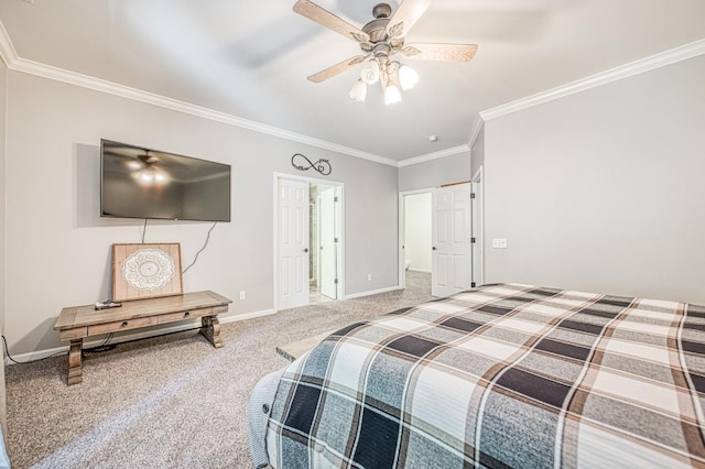 carpeted bedroom featuring baseboards, ornamental molding, and ceiling fan