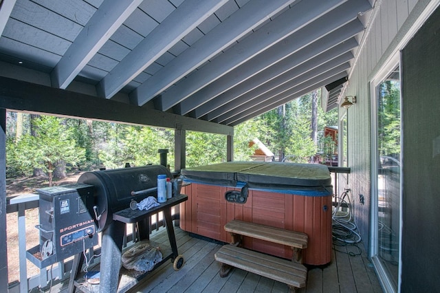 wooden terrace featuring a hot tub and area for grilling
